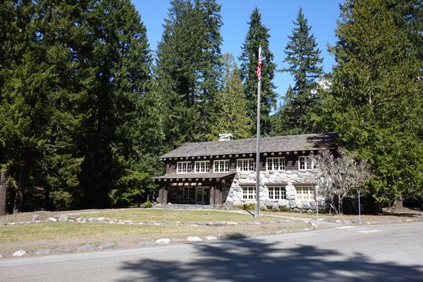 A two-story wood and rock building.