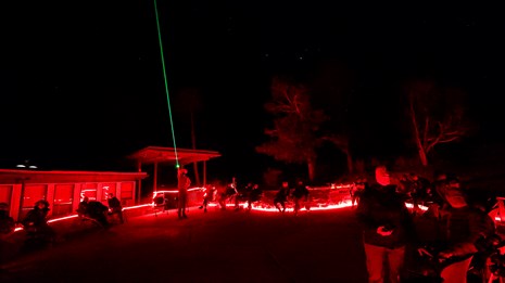 Red lit ranger program with ranger using green laser pointer.