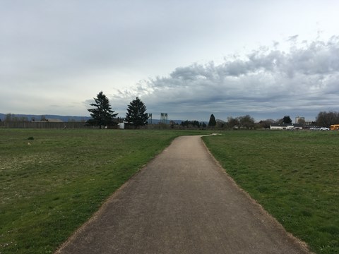 A paved trail leading towards Fort Vancouver.