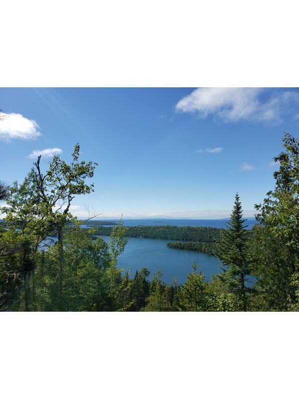 The forested islands of Isle Royale National Park surrounded by Lake Superior.