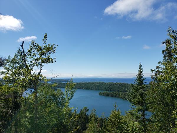 The forested islands of Isle Royale National Park surrounded by Lake Superior.