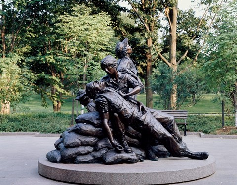 Statue of two women caring for fallen soldier.