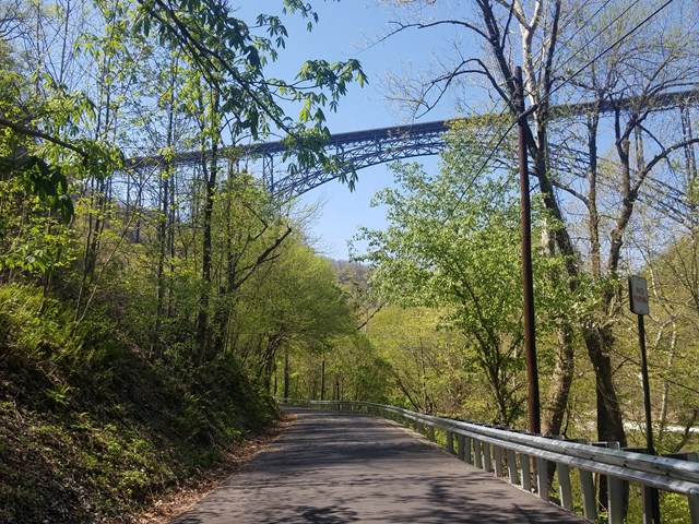 A road passing beneath the New River Gorge Bridge
