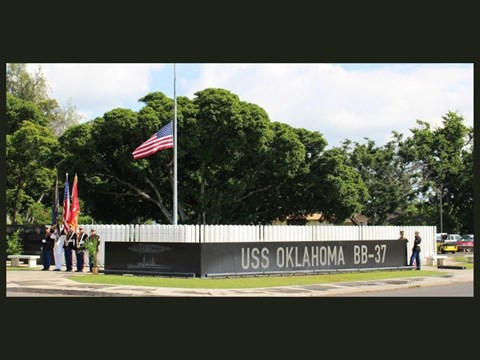 The flag flies full staff at the USS Oklahoma Memorial