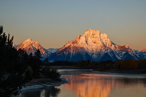 A river with mountains in the background.