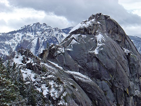 Snowy conditions on a large granite dome.