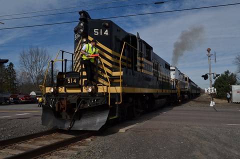 Diesel locomotive number 514 at a road crossing