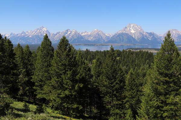 A mountain range and a lake as viewed from a high vantage point.