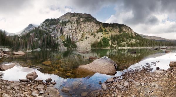 a lake with a large mountain behind it