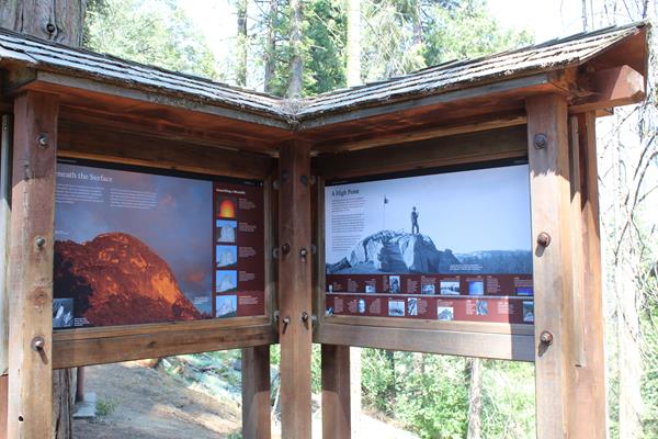 Two exhibit panels show images and share text about the geology of Moro Rock.