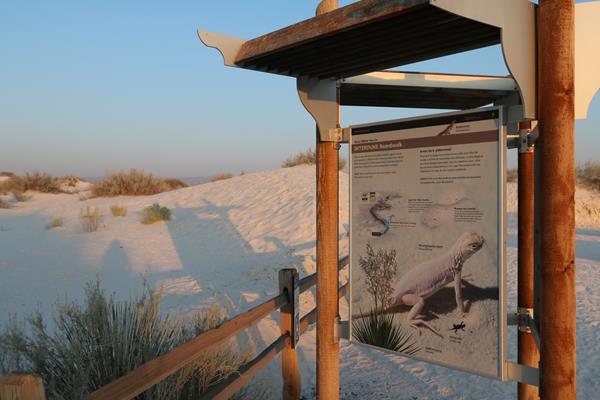 The Interdune Boardwalk kiosk panel just before sunset.