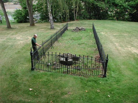 Iron fence surrounding chimney of mission site