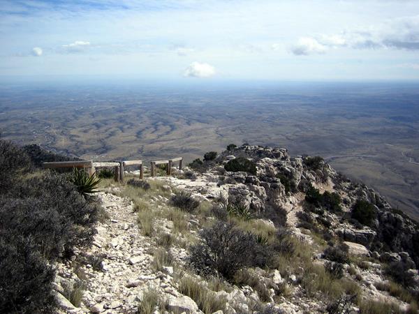 Wooden hitching posts for stock on a high desert mountain peak.
