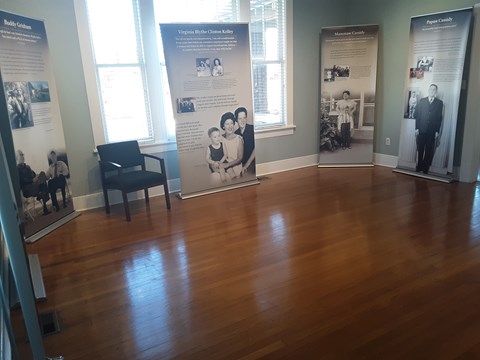 Exhibit panels describe the childhood and influences of President Bill Clinton.