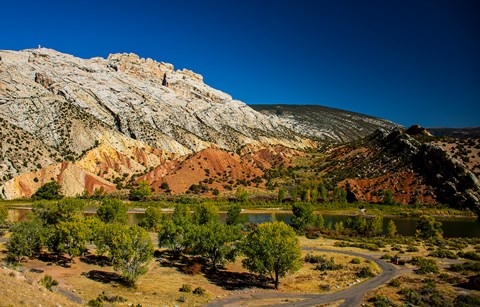 This view from the Cub Creek Road reveals Split Mountain rising above multicolored rock formations.