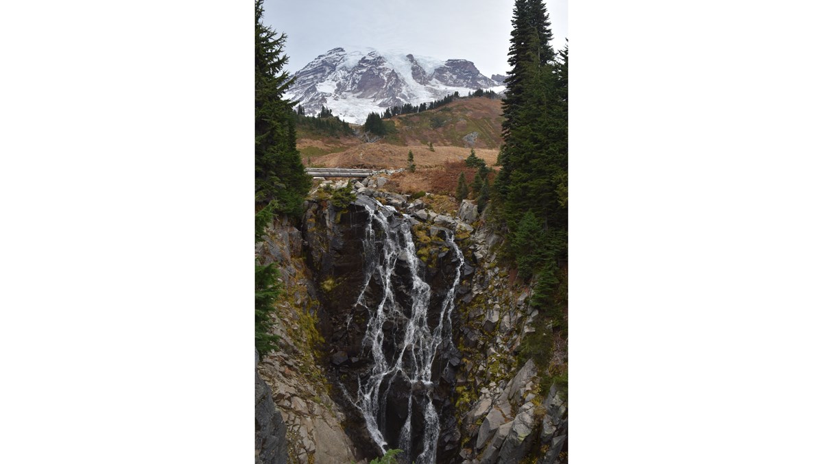 Braided cascade of Myrtle Falls with the glaciated mountain rising behind it.