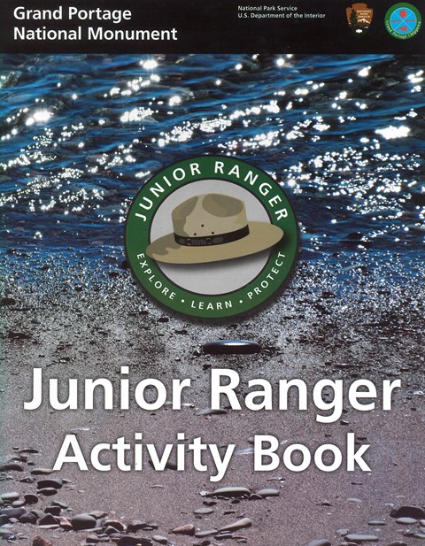 A photo of water and beach with a Junior Ranger logo superimposed in the center.