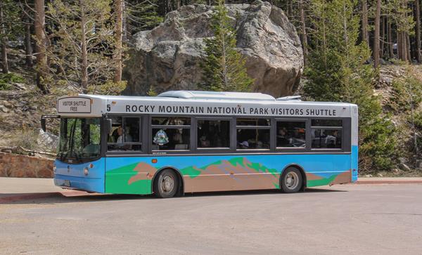 One of the park's shuttle buses is driving on Bear Lake Road