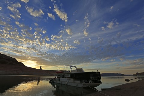 houseboat beached on lakeshore at dawn