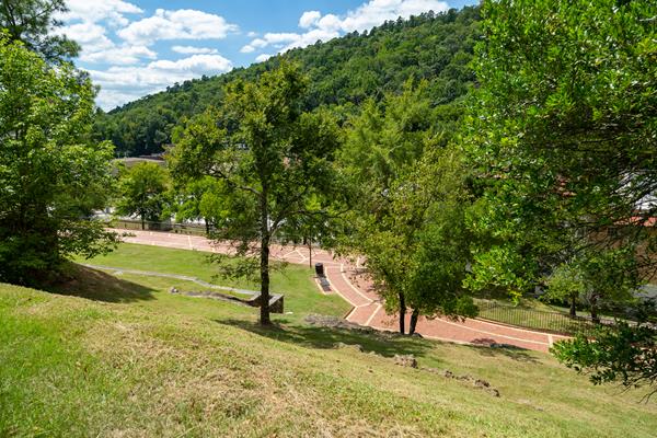 Two people walking up the stairs ti the grand promenade