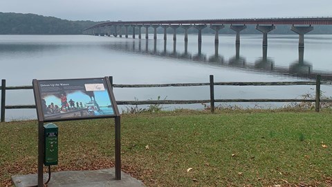 Informative panel explaining Trail of Tears in foreground. Tennessee River flows in distance
