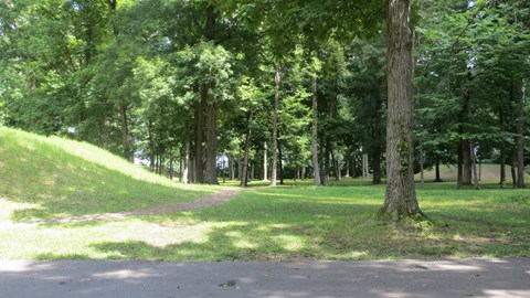 Two Indian mounds covered in green grass