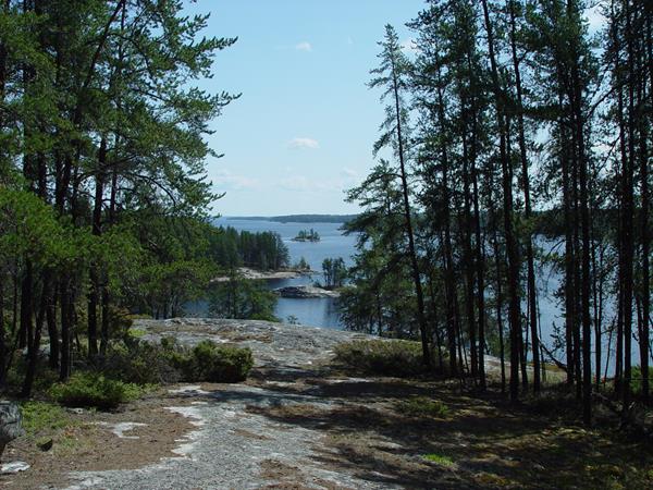 A view from a rocky out cropping of a lake with islands scattered throughout.