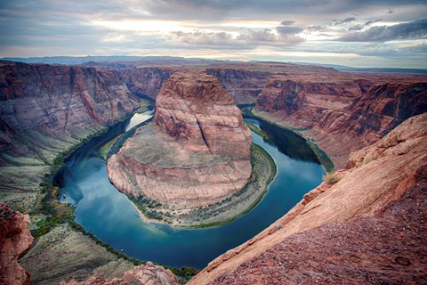 River in almost circular curve at bottom of sandstone canyon
