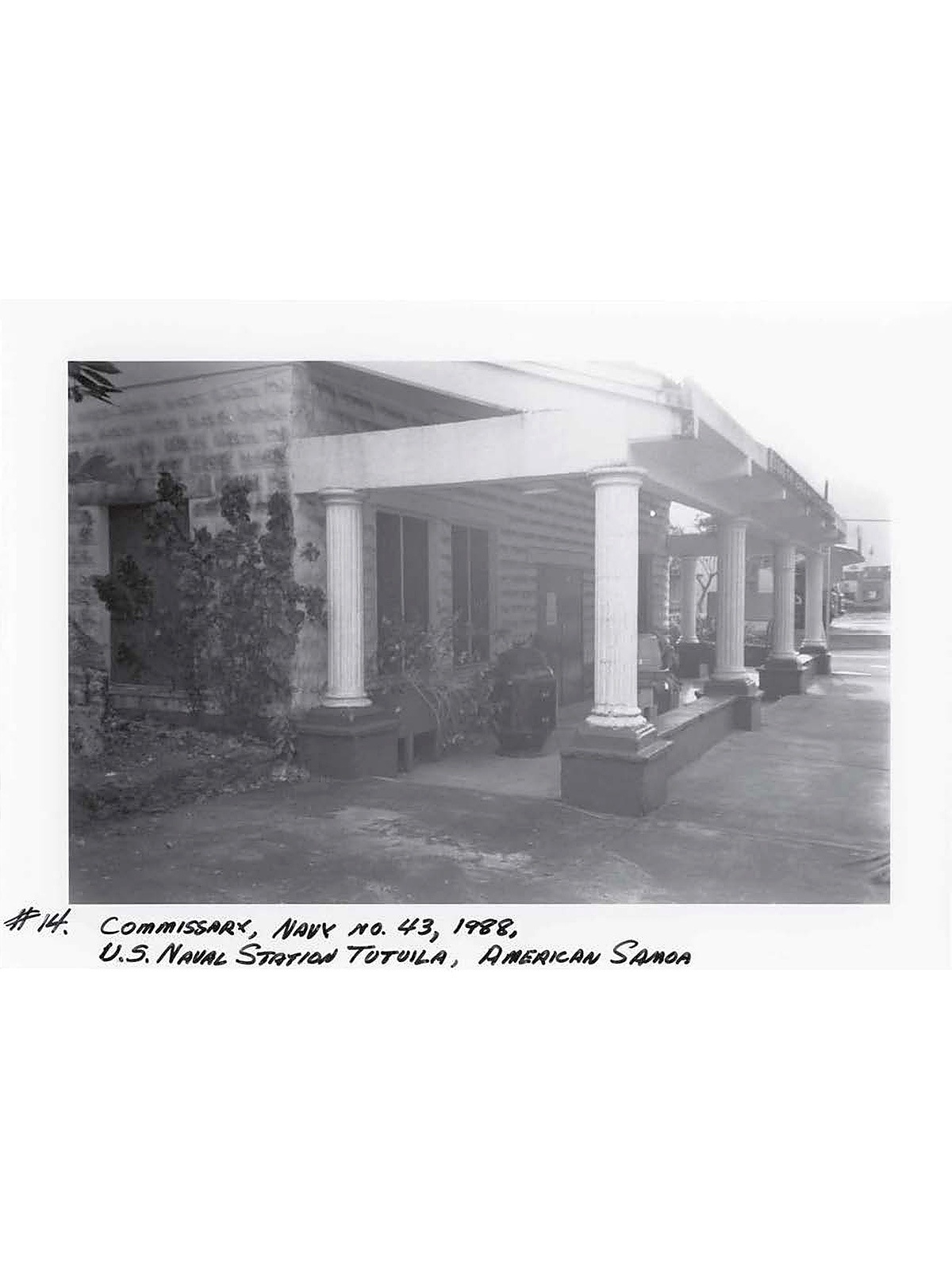 Black and white historical photo of a building with columns