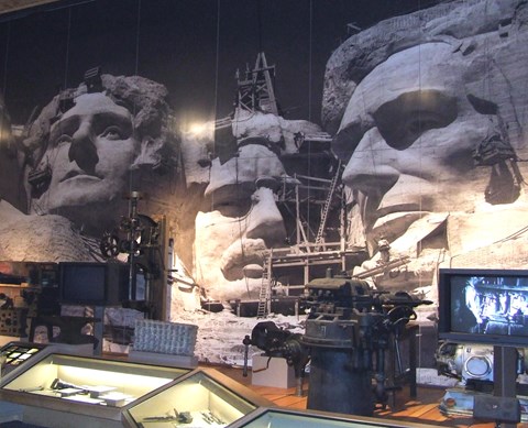 Photo of exhibits inside the Lincoln Borglum Visitor Center showing tools and photos.