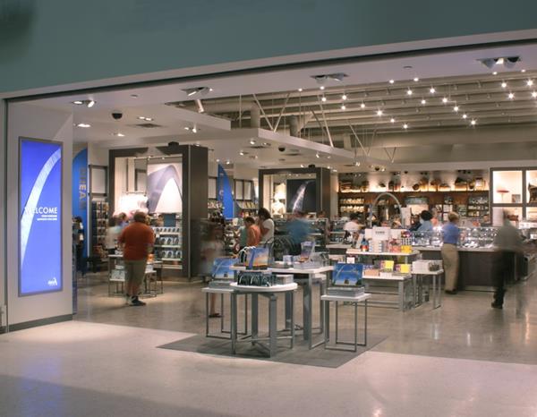looking into the store, a large area with tables and racks of merchandise