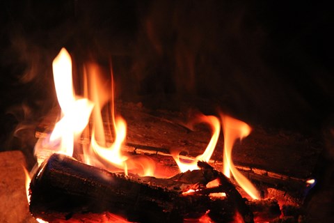 Flames rising from wood