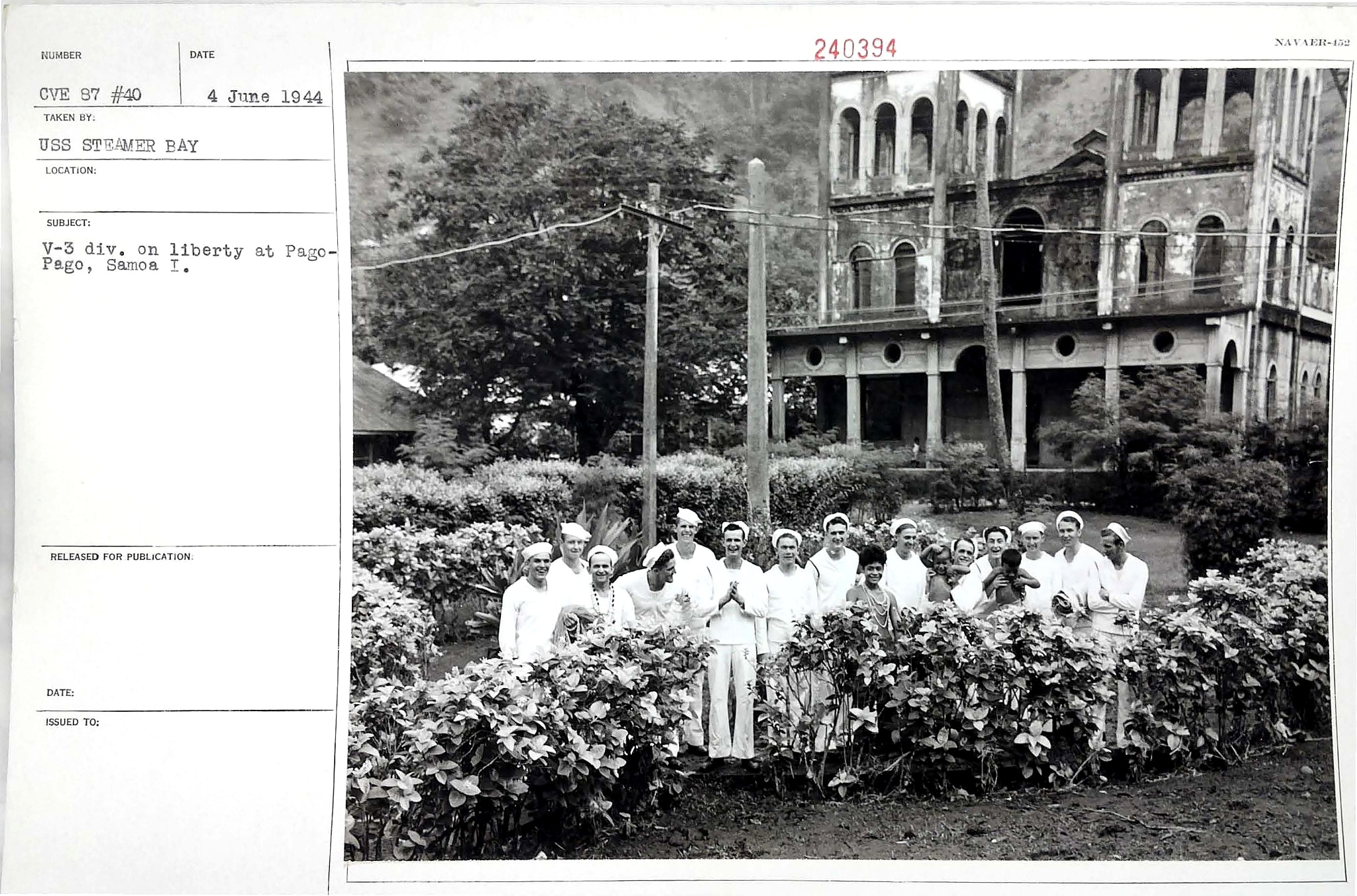 A group of people dressed in white stand in front of a church