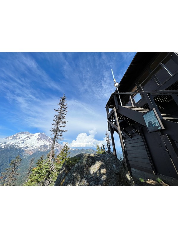 View of glaciated mountain from wooden fire lookout