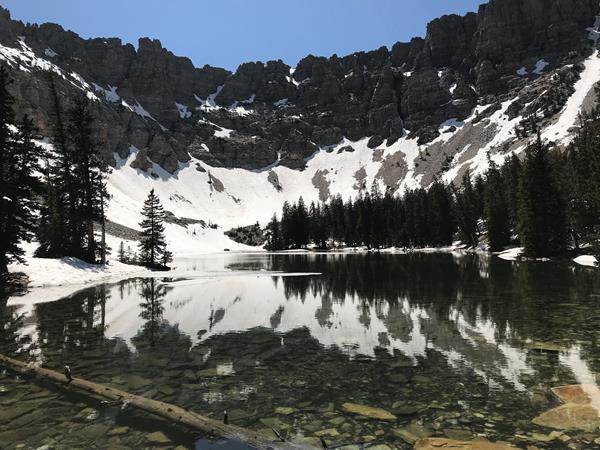 Mountain ridge partly covered in snow