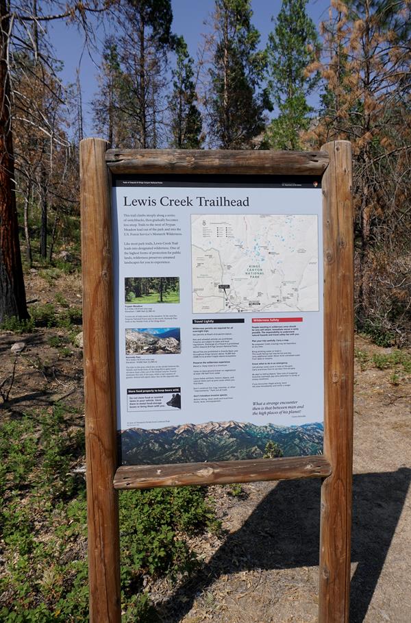 The map and trail info is on a blue trail sign.