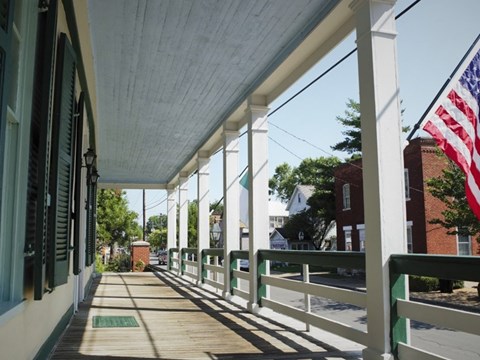 View of a street from the front porch of a home
