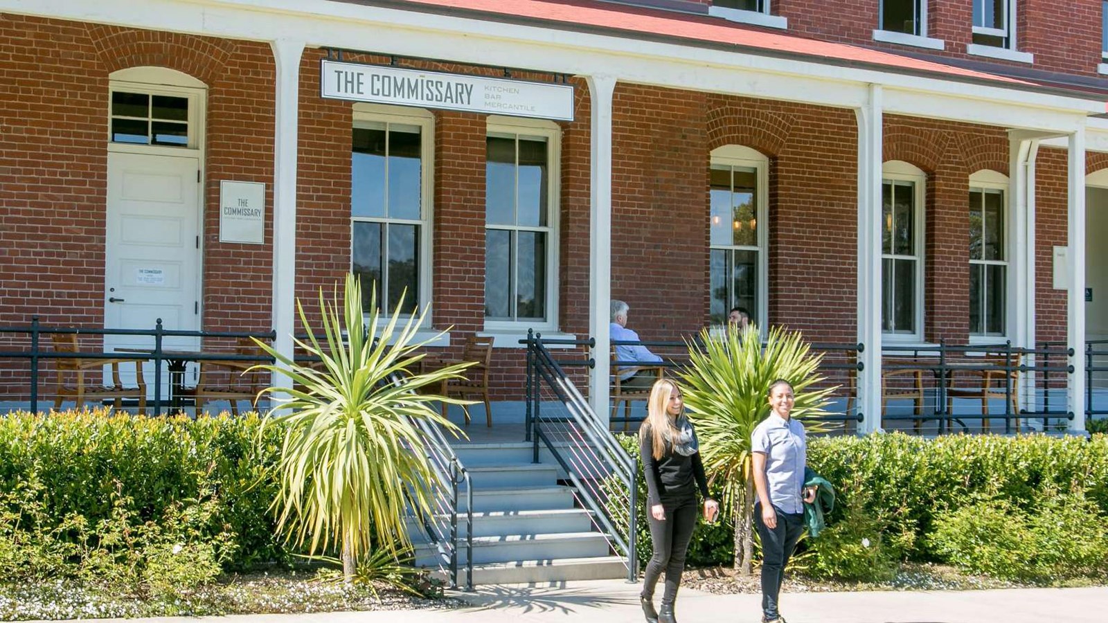 The entrance to the Commissary, with its bright red brick and big front porch.