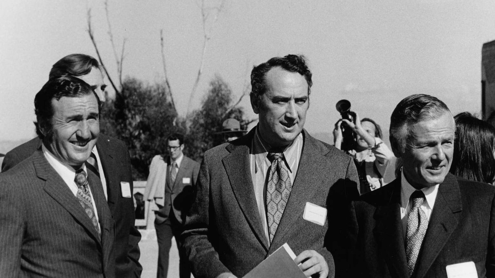 Phil Burton on a tour of Alcatraz Island, surrounded by Peter Arrigoni, John Jacobs, Bill Maillard.