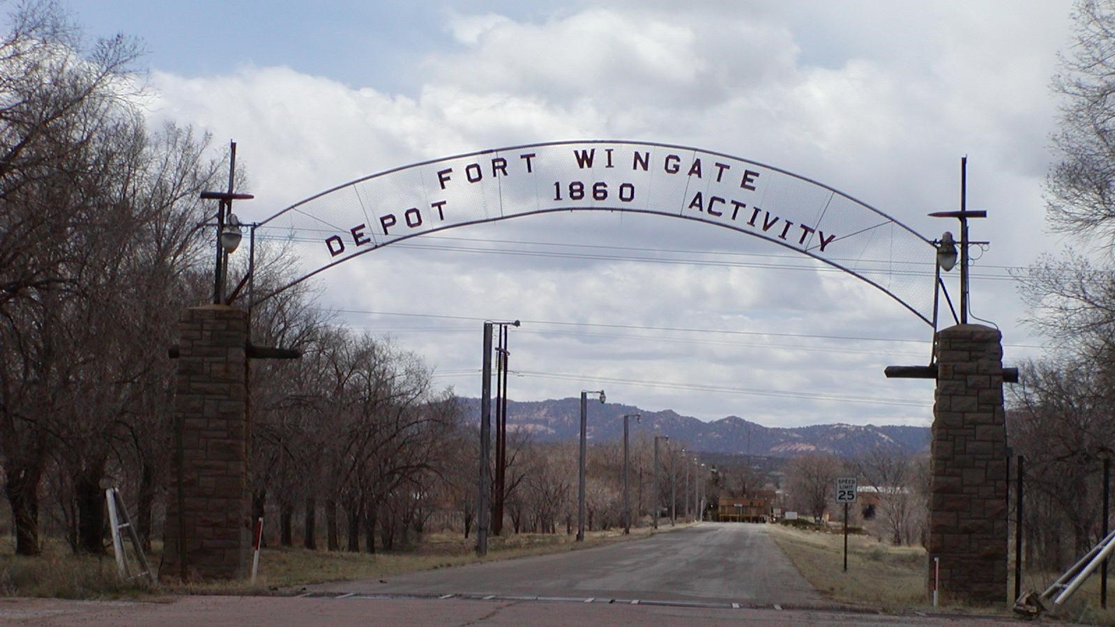 A large arched metal sign reads 