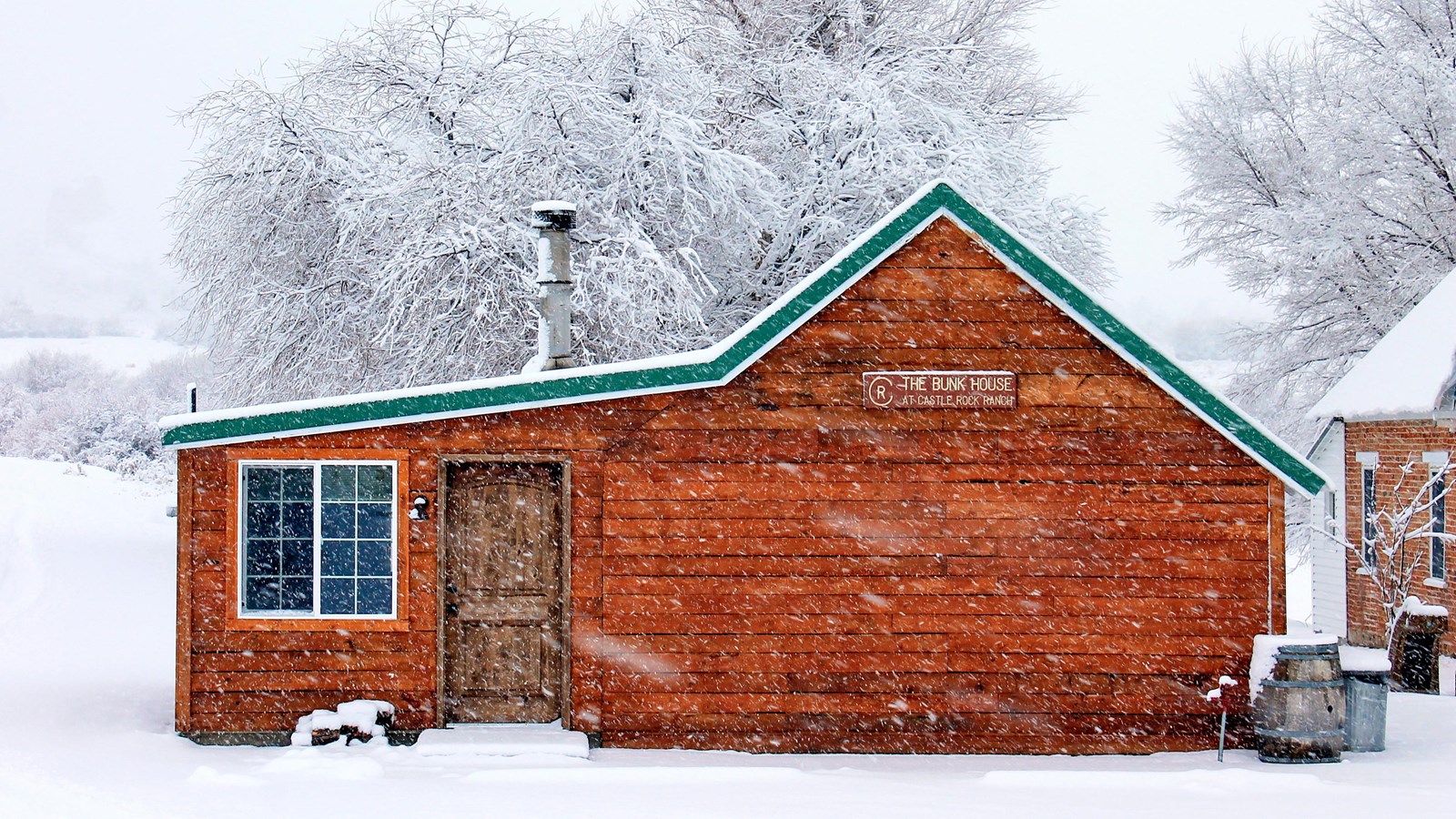 Front view of The Bunkhouse in a snowy winter scene.