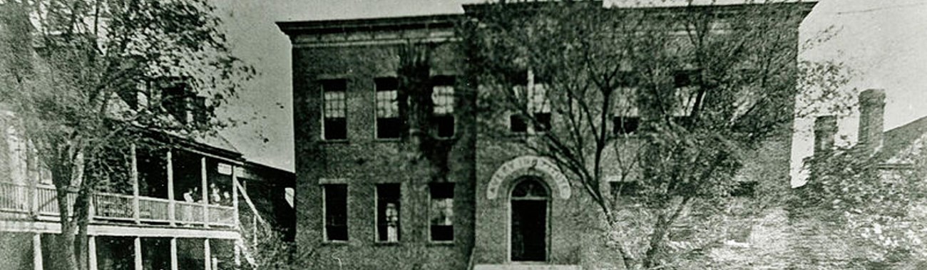The Avery Normal Institute in 1870, surrounded by picket fence.