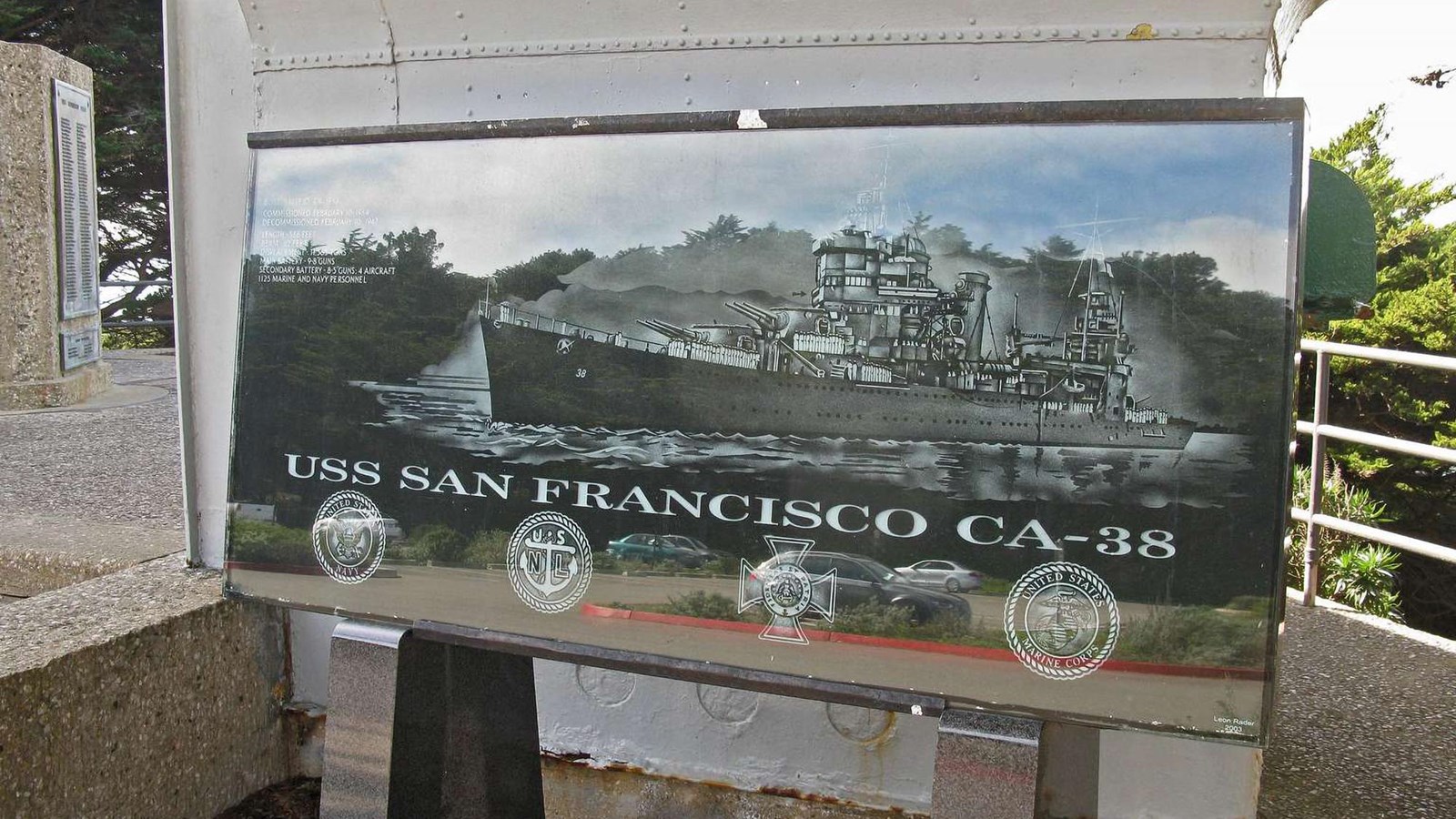 An image of the USS San Francisco etched on black granite.
