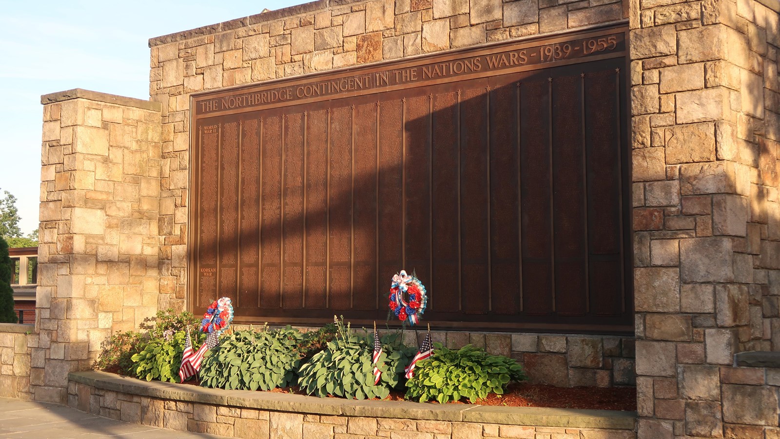Large stone memorial listing names of service members
