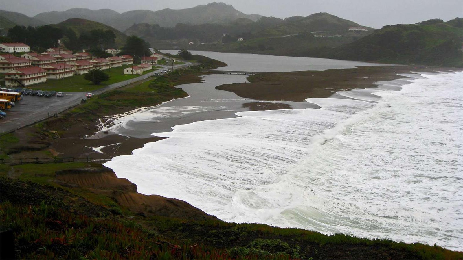 Water washing across Rodeo beach at high tide during a winter storm.