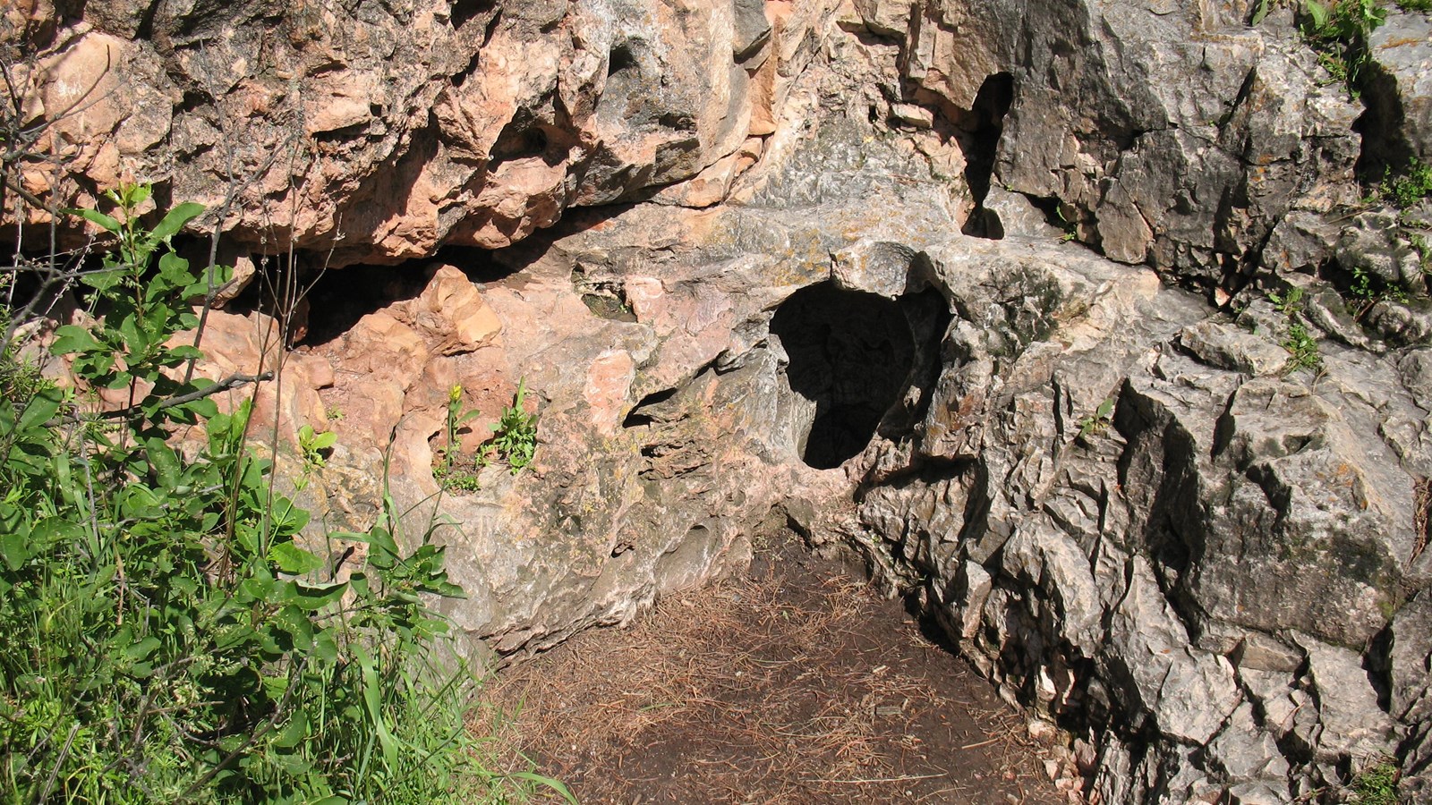 a small hole in a cream colored stone depression