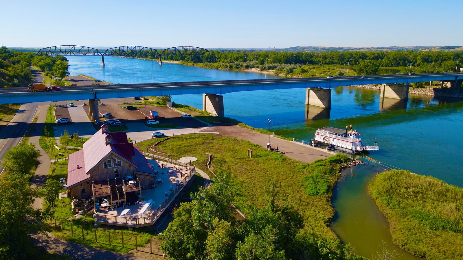 Visitor Center on the banks of the Missouri River with historic bridge  