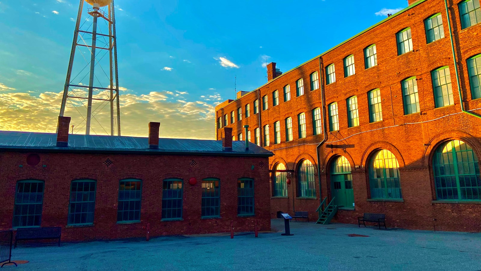 Buildings and Water tower in gravel topped courtyard area