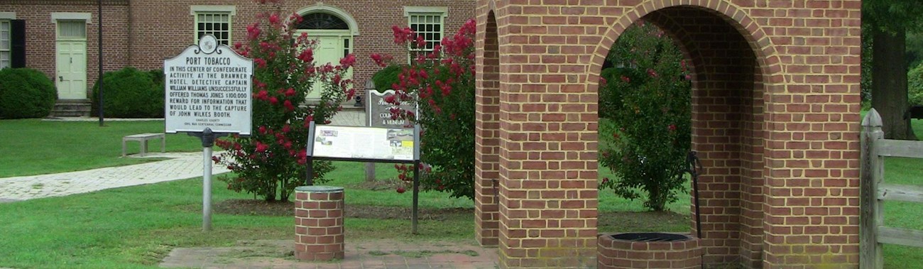 historic red brick buildings with historic marker