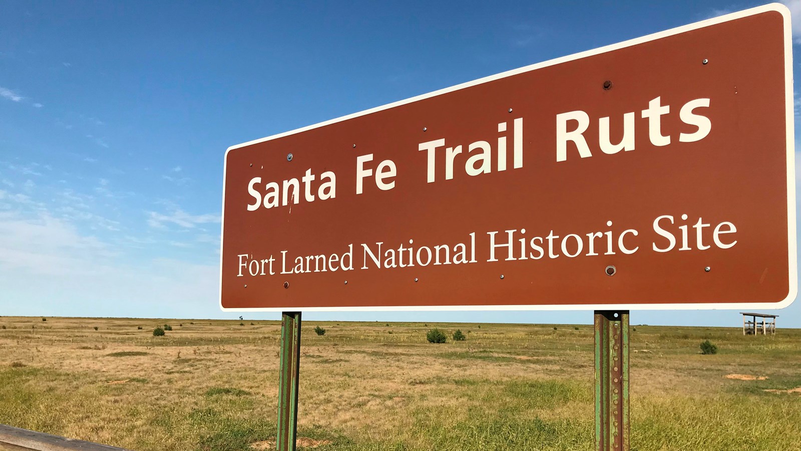 A large brown sign that says,